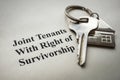 Key lie on paper with a mark Joint tenants with right of survivorship.