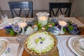 Key lime Cheesecake on an antique cake stand on a table