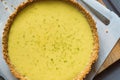 Key lime pie with graham cracker crust resting on parchment paper. Overhead view. Royalty Free Stock Photo