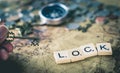 Key Lock concept text on vintage world map Royalty Free Stock Photo