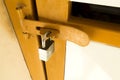 Lock key on old yellow metal door. Royalty Free Stock Photo