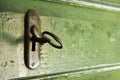 Key and lock on the green wooden door Royalty Free Stock Photo