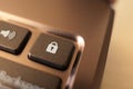 Key with lock on a laptop keyboard. Macro shallow DOF