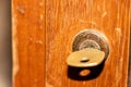 Key lock in wood cabinet with key inserted Royalty Free Stock Photo