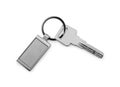 Key with metallic keychain isolated on white, top view Royalty Free Stock Photo