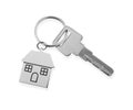 Key with metallic keychain in shape of house isolated on white, top view Royalty Free Stock Photo