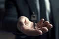 Key model in the hands of a forward-thinking businessman, representing success Royalty Free Stock Photo