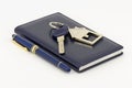 Key, notebook and pen Royalty Free Stock Photo
