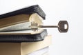 Key and open book bible. metaphor key to cognition wisdom and knowledge Royalty Free Stock Photo
