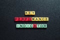 Key perfomance indicator - word concept on cubes, text