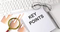 KEY POINTS text written on a notebook with keyboard, chart,and glasses Royalty Free Stock Photo