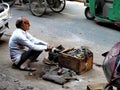 Key seller and knife sharpener in Chandni Chowk, Old Delhi.