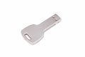 Key-shaped USB stick isolated on a white background Royalty Free Stock Photo