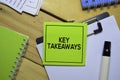 Key Takeaways on sticky Notes isolated on office desk. Royalty Free Stock Photo