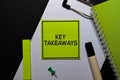 Key Takeaways on sticky Notes isolated on office desk Royalty Free Stock Photo