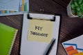 Key Takeaways write on sticky notes isolated on Wooden Table Royalty Free Stock Photo