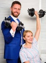 Key to success concept. Man and woman raise heavy dumbbells. Strong powerful business strategy. Boss businessman manager Royalty Free Stock Photo