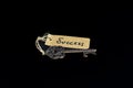 Key to Success concept - Old key with success tag isolated on black background Royalty Free Stock Photo
