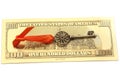 Key To Success With Red Bow on Golden hundred dollar bill Royalty Free Stock Photo