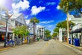 KEY WEST, FL - FEBRUARY 15, 2016: City street full of shops on a beautiful sunny day Royalty Free Stock Photo