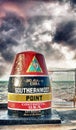 Key West, Florida Buoy sign marking the southernmost point on the continental USA and distance to Cuba. Sunset view