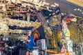 Musician performs in a bar with plastered dollar bills, in Key West Florida