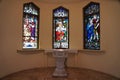 Key West, Florida - February 22, 2022 - The colorful stained glass by the Baptismal Font inside of St Paul Episcopal Church