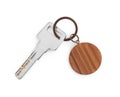Key with wooden keychain isolated on white, top view Royalty Free Stock Photo