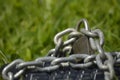 Keyboard chained on grass.