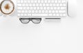 Keyboard, coffee cup, glasses, pen and pencil on white office desk table, top view, copy space, 3d rendering Royalty Free Stock Photo