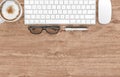 Keyboard, coffee cup, glasses, pen and pencil on wood office desk table, top view, copy space, 3d rendering Royalty Free Stock Photo