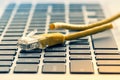 Keyboard with cut internet cable Royalty Free Stock Photo