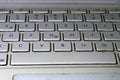 Keyboard on a dirty white laptop Royalty Free Stock Photo