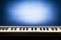 Keyboard of electric organs on a blue illuminated background Royalty Free Stock Photo