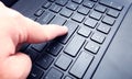 Keyboard with finger pressing enter key Royalty Free Stock Photo