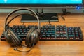Keyboard and headphones on the table Royalty Free Stock Photo
