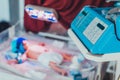 A keyboard on an infant warmer and a baby in it at the blurred background.