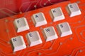 Keyboard keys form the word FAKE NEWS on red electric circuit in Royalty Free Stock Photo