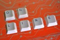 Keyboard keys form the word ON LINE on orange electric circuit in the background