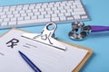 Keyboard and Medical stethoscope lying on cardiogram chart closeup. Medical help, prophylaxis, disease prevention or Royalty Free Stock Photo