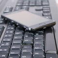 Keyboard and mobile phone Royalty Free Stock Photo