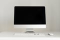 Keyboard, mouse, computer display with black blank screen. Front view. Designer workspace on grey background. Minimalistic home