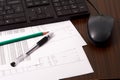 Keyboard, mouse, papers, pen and pencil on the table