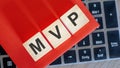 on keyboard notebook cubes with the inscription - MVP, red paper on background Royalty Free Stock Photo