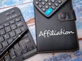 Keyboard and notebook with the word Affiliation