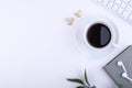 Keyboard, notepad, cup of coffee, top view