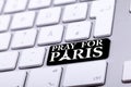 Keyboard with pray for paris text and symbol Royalty Free Stock Photo