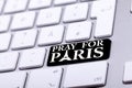 Keyboard with pray for paris text and symbol Royalty Free Stock Photo