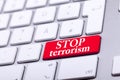 Keyboard with red button and stop terrorism word on it