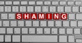 Keyboard with red buttons and shaming text Royalty Free Stock Photo